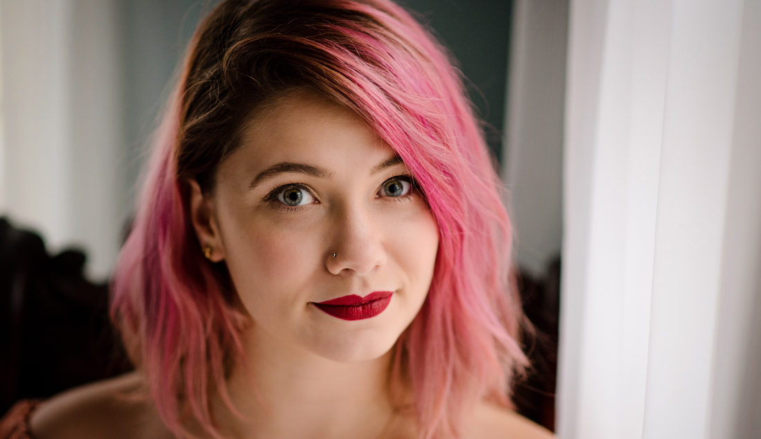 portrait of young woman with magenta hair
